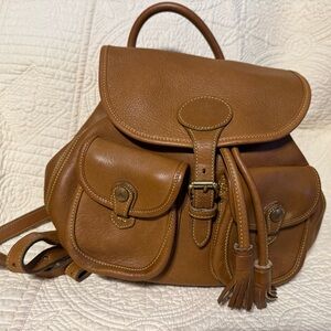 Dooney & Bourke tan pebbled leather drawstring backpack